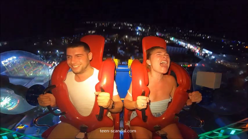 WN - girls boobs falls out of sling shot ride